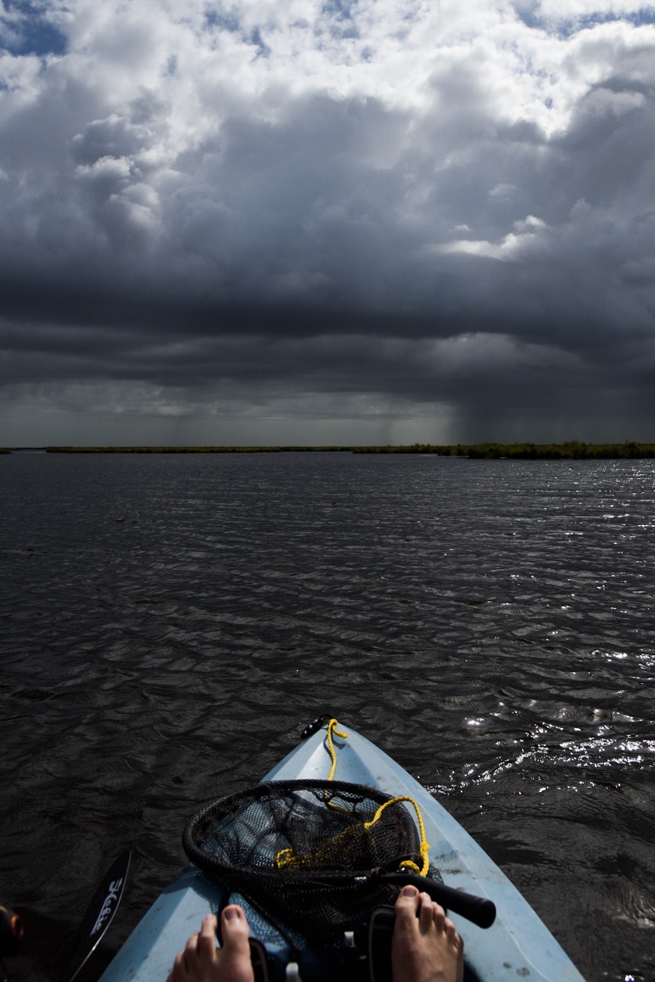 A distant storm as seen from a Hobie kayak