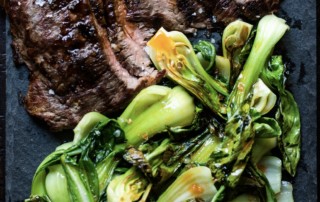 Grilled flank steak and bok choy drizzled with Fresno chili crush olive oil