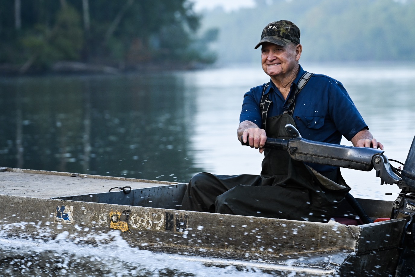 Wilven Hayes, 85, guiding his fishing boat down the Atchafalaya River