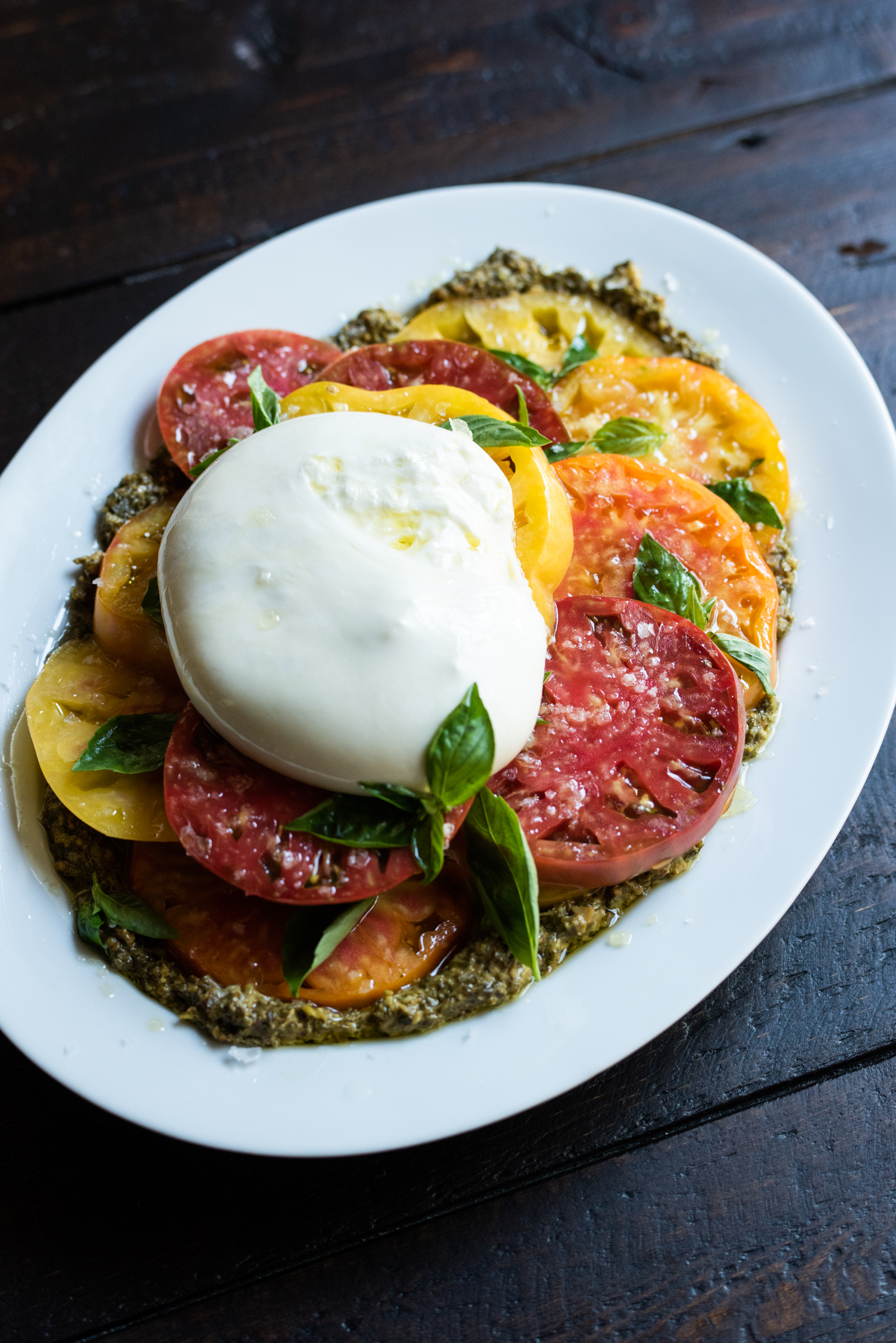 Burrata, heirloom tomatoes and pesto with olive oil