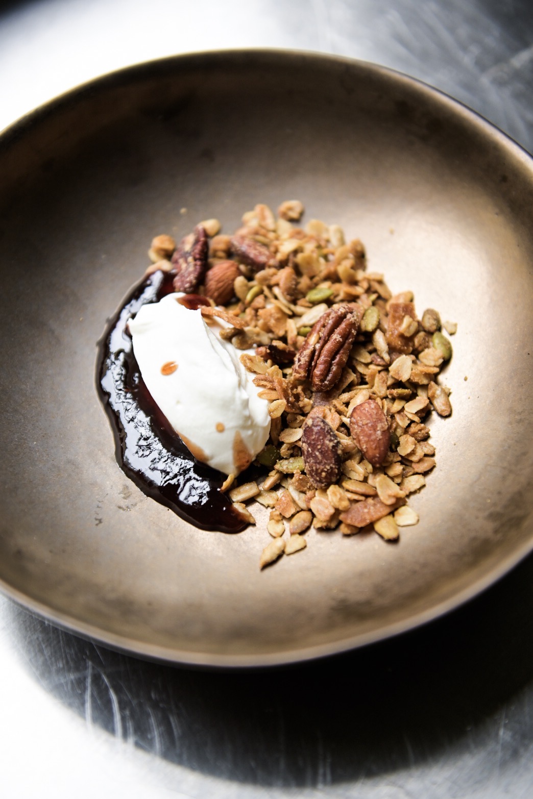 Olive oil and maple granola with yogurt and pluot jam