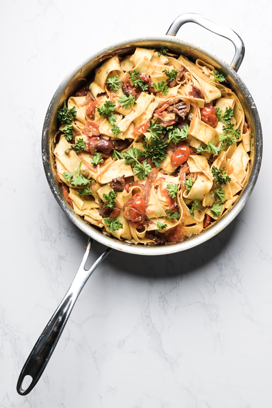 Pappardelle with harissa, olives, capers and tomatoes