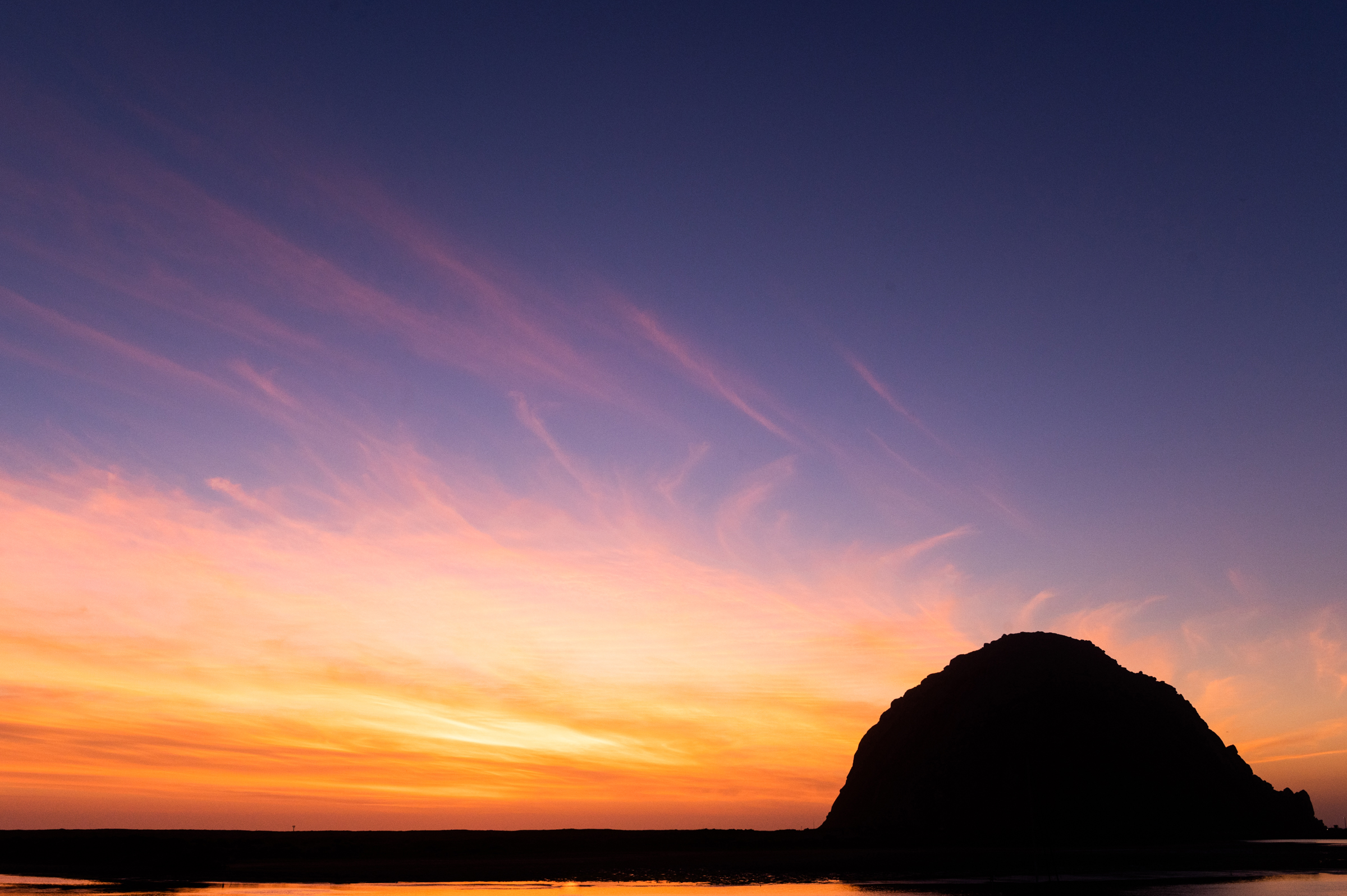Morro Rock during a vibrant sunset