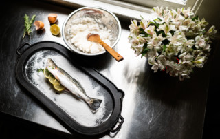 A speckled trout prepped for a salt crust for baking