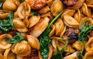 Seared scallops with orecchiette and spinach