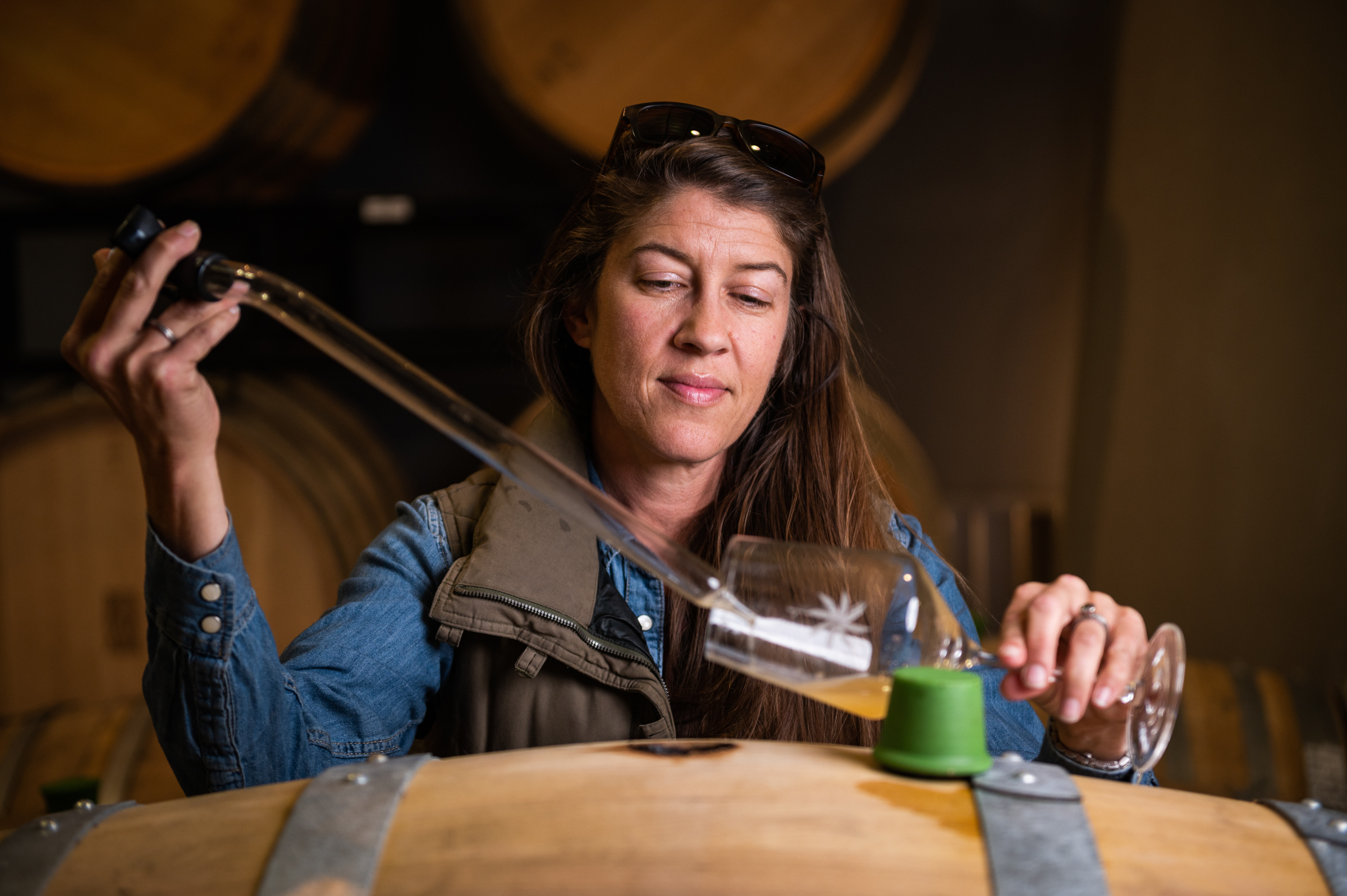 Desparada winemaker Vailia Esh pulls wine from a barrel