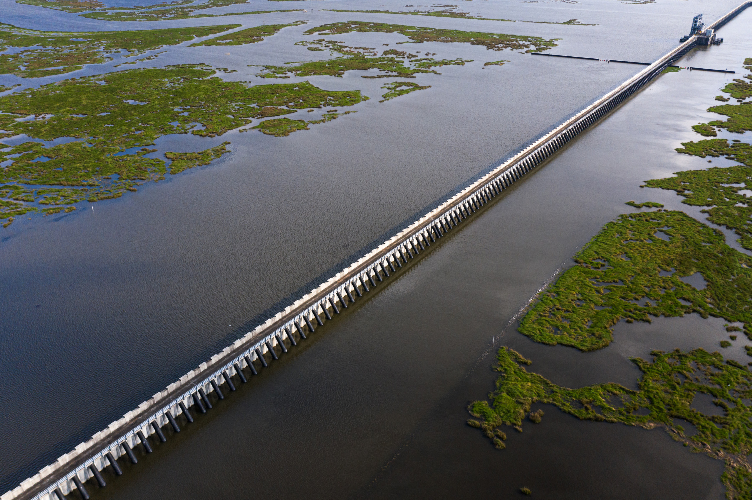 Aerial view of the IHNC Lake Borgne Surge Barrier cutting through the marsh