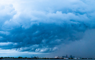 A storm passes over New Orleans, photographed from the river in Arabi