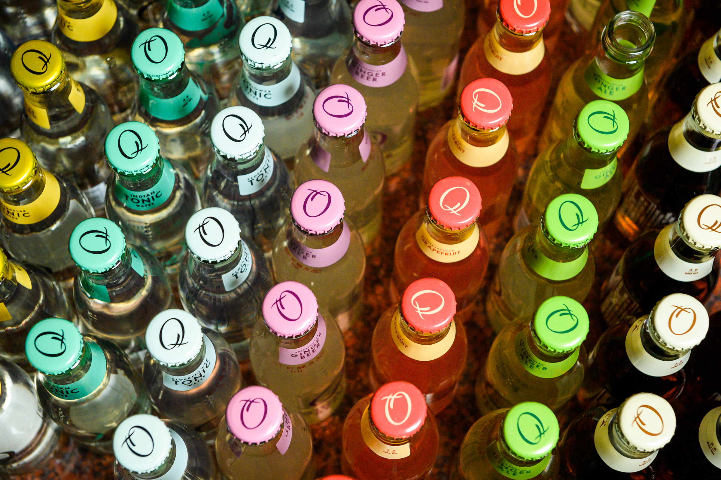 Lineup of bottle tops from Q Mixers products