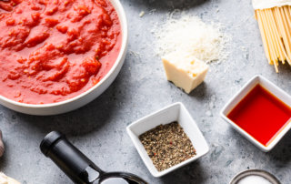 Ingredients for the Bucatini Meal Kit featuring ENZO Olive Oil Fresno Chili Crush and My Italian Cousin cabernet