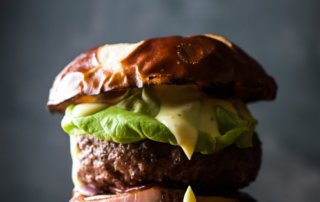 Portrait of a burger, with a perfect drip of aioli