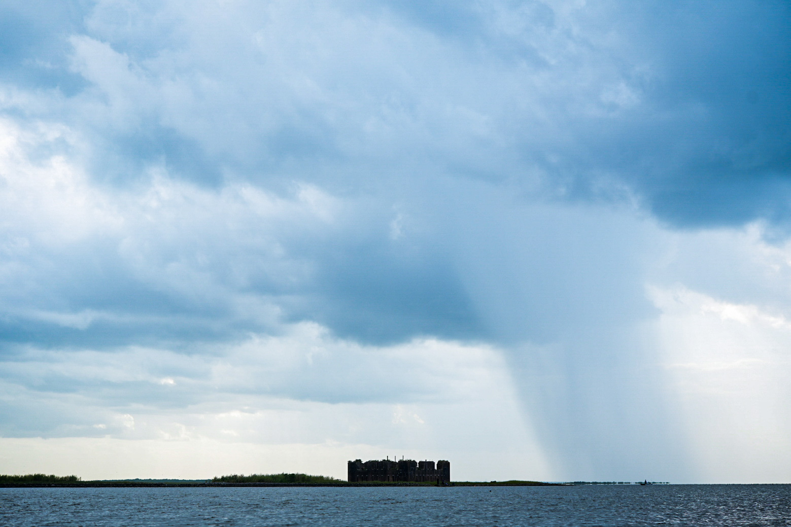 Rain falls as a storm passes over Fort Proctor on Lake Borgne