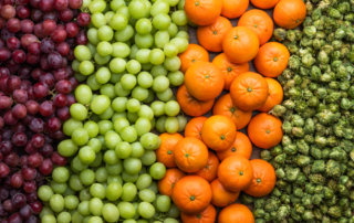 Colorful display of grapes, mandarins and hops, grown by Fowler Packing