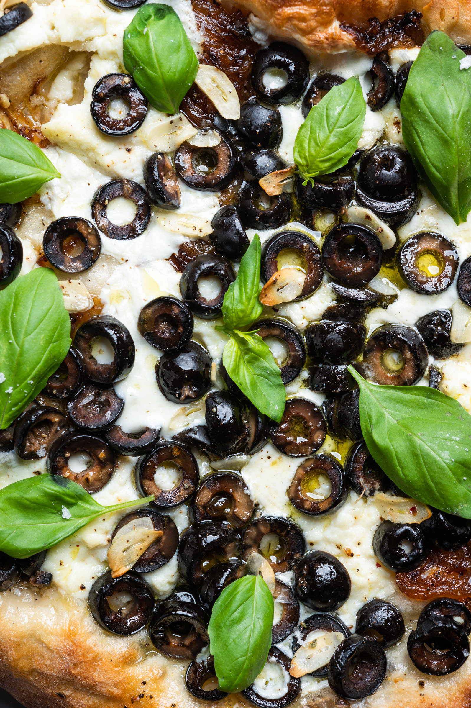 California Ripe Olives baked with cheese and olive oil on a pizza