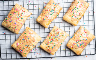 Baked and glazed prune pop tarts with sprinkles