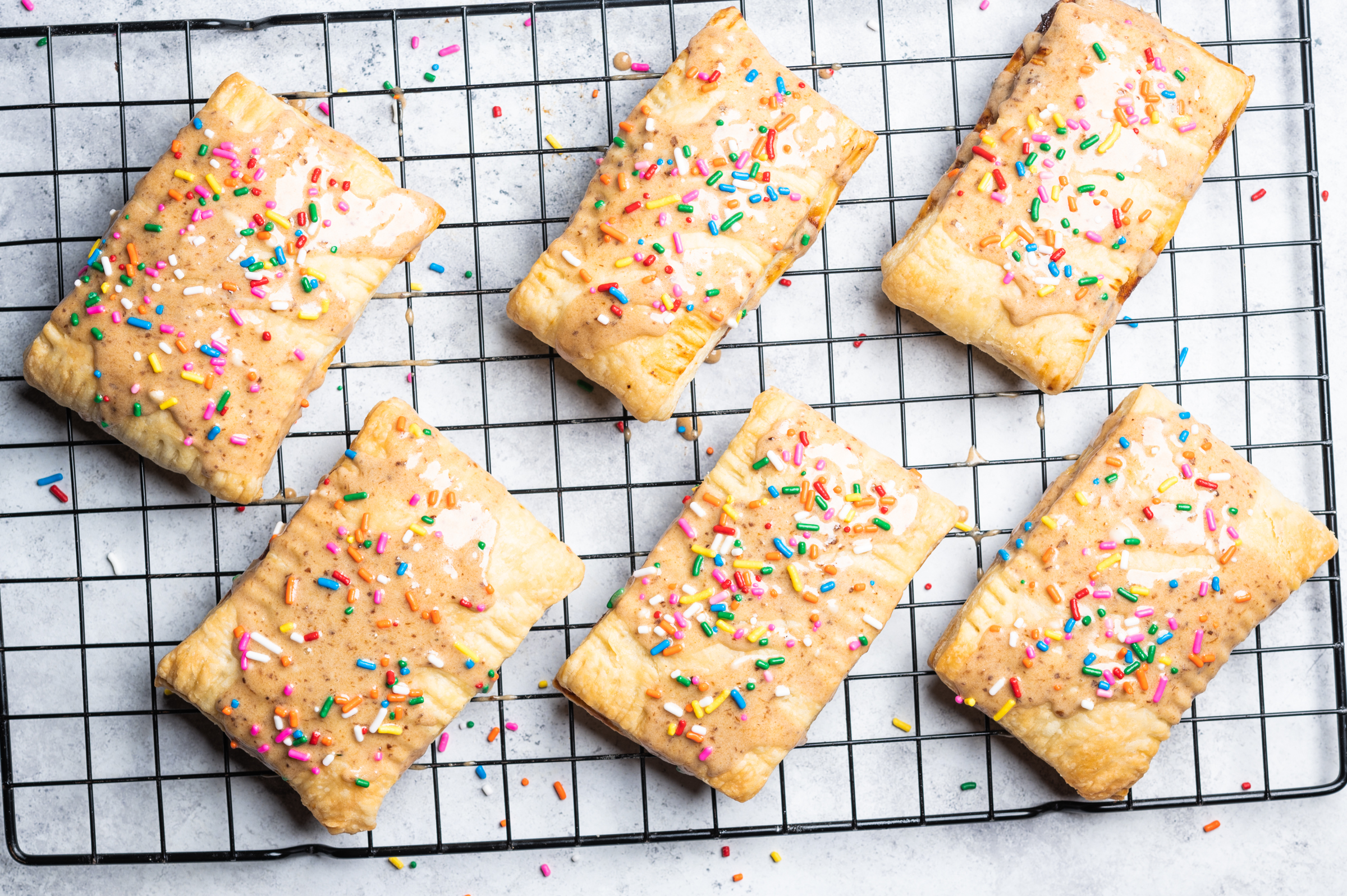 Baked and glazed prune pop tarts with sprinkles