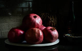 Fresh pomegranates from Loquaci Ranch in window light