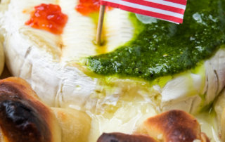 Garlic knots with melted Président brie and herb pistou