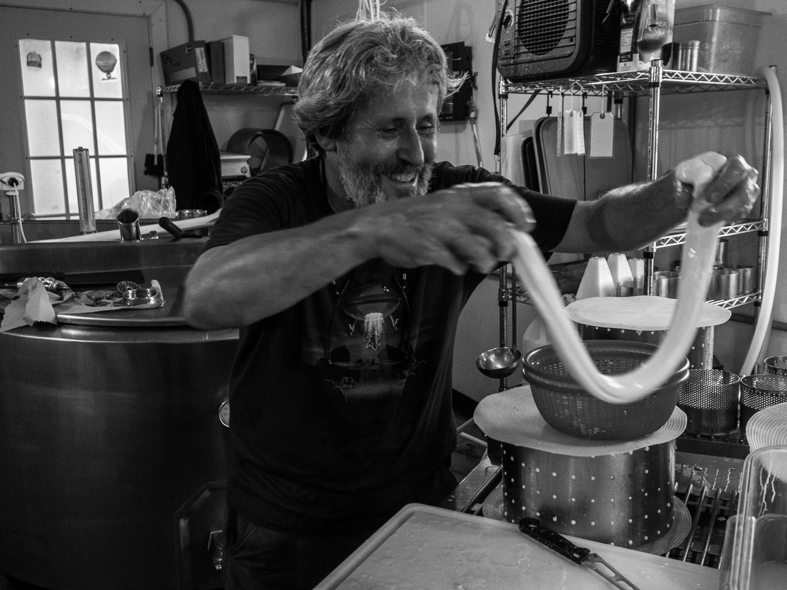 Jonathan White stretches curds for cheese