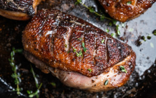 Tea-brined duck breast seared in a skillet then roasted to medium temperature