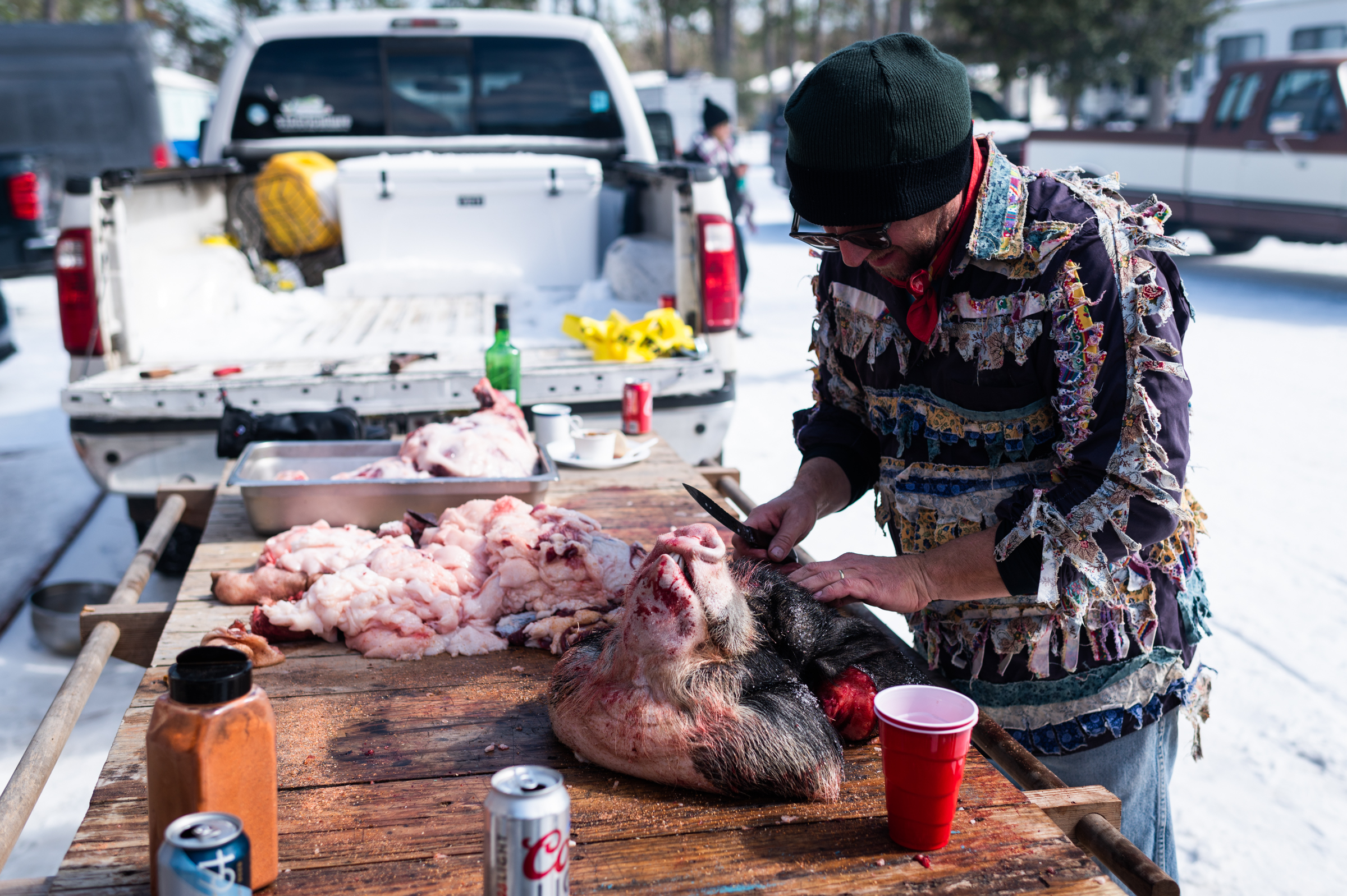 Bryan stands in front of the butchered hog on a custom butcher table