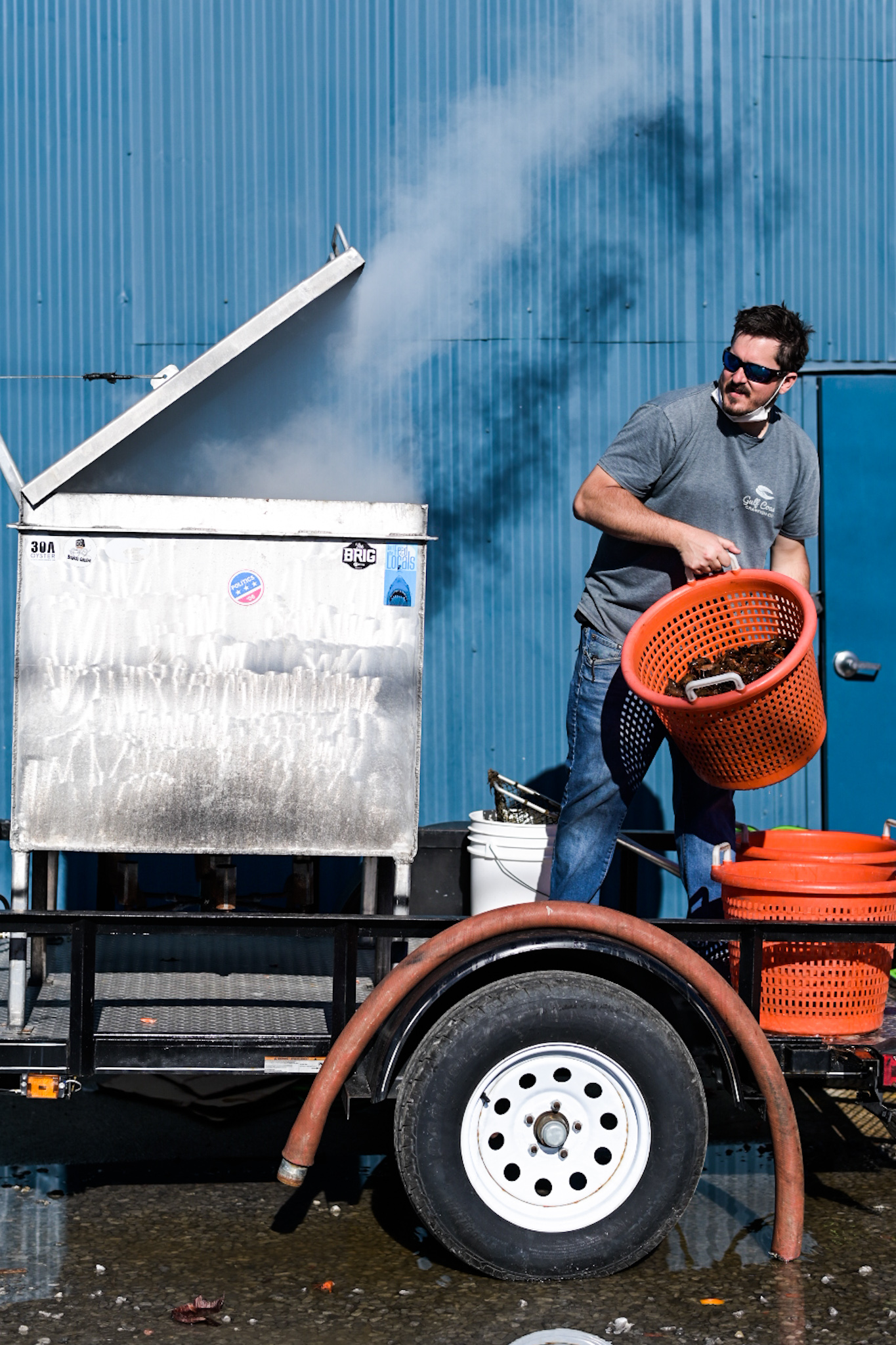 Evan Troxell of Gulf Coast Crawfish adds crawfish to a boil