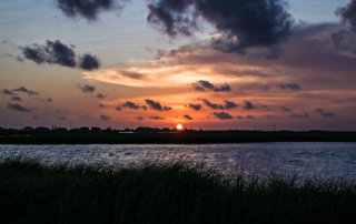 Sunset over the marsh next to Grand Bayou Village near Port Sulphur, Louisiana