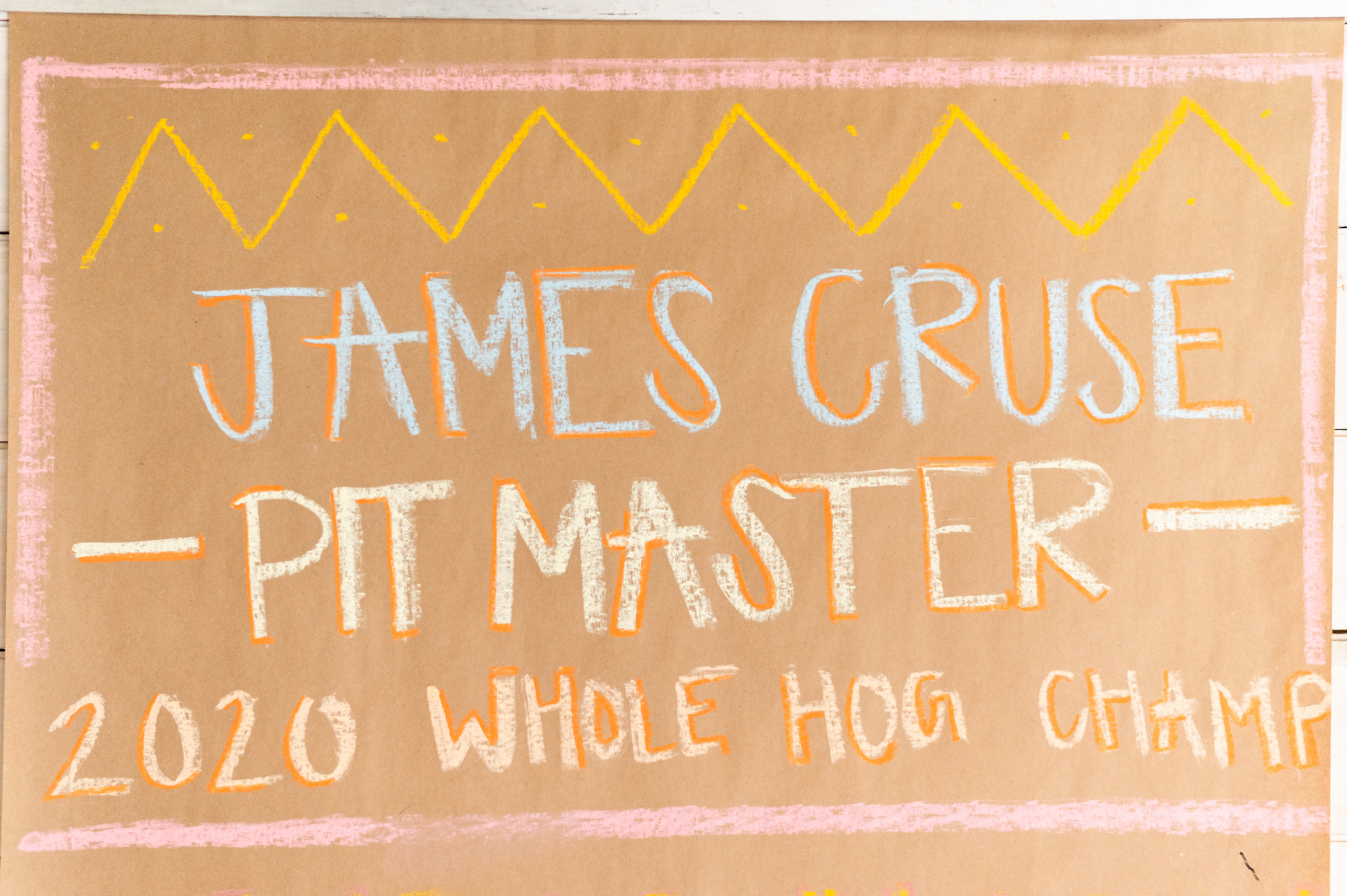 Inside Central City BBQ, a roll of butcher paper lists some of James Cruse's barbecue honors
