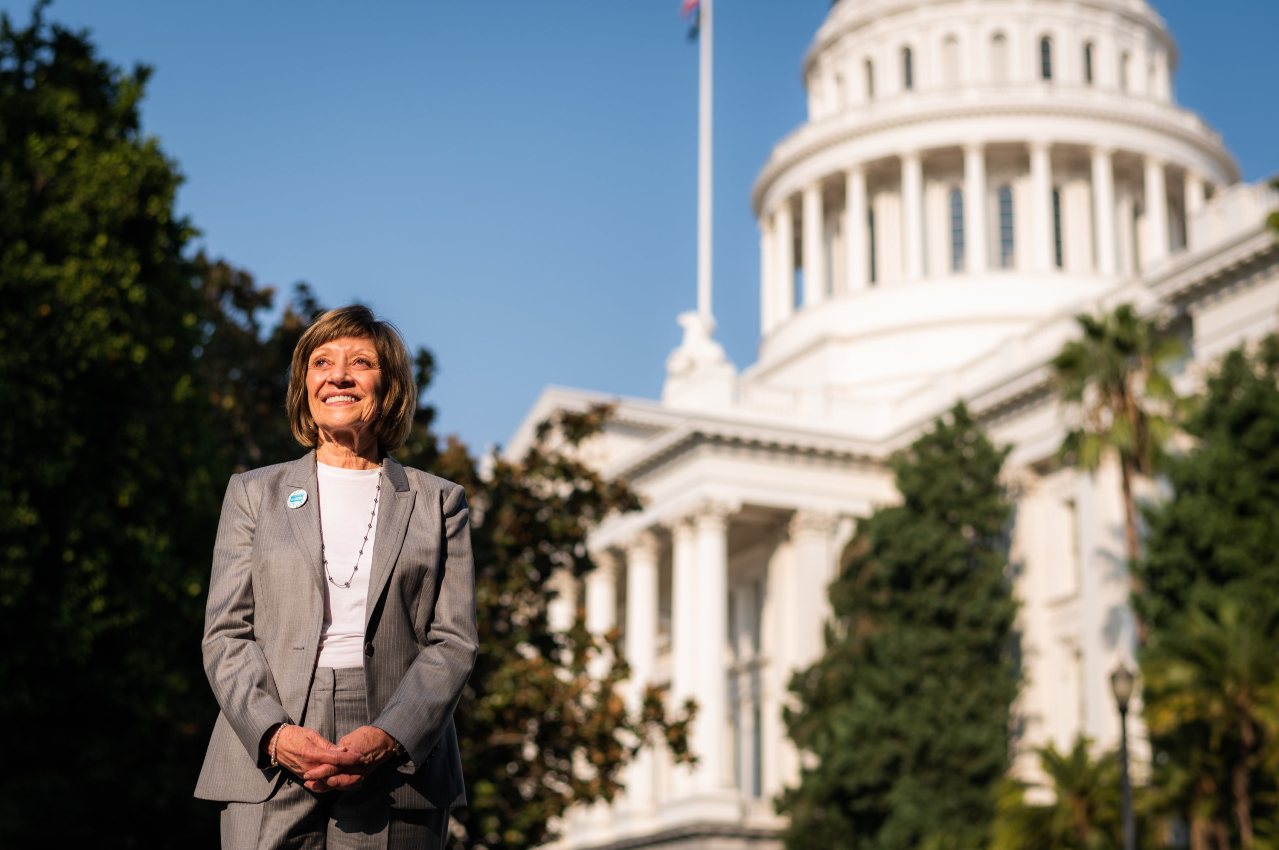 Secretary Karen Ross poses for a portrait in front of California's capitol building