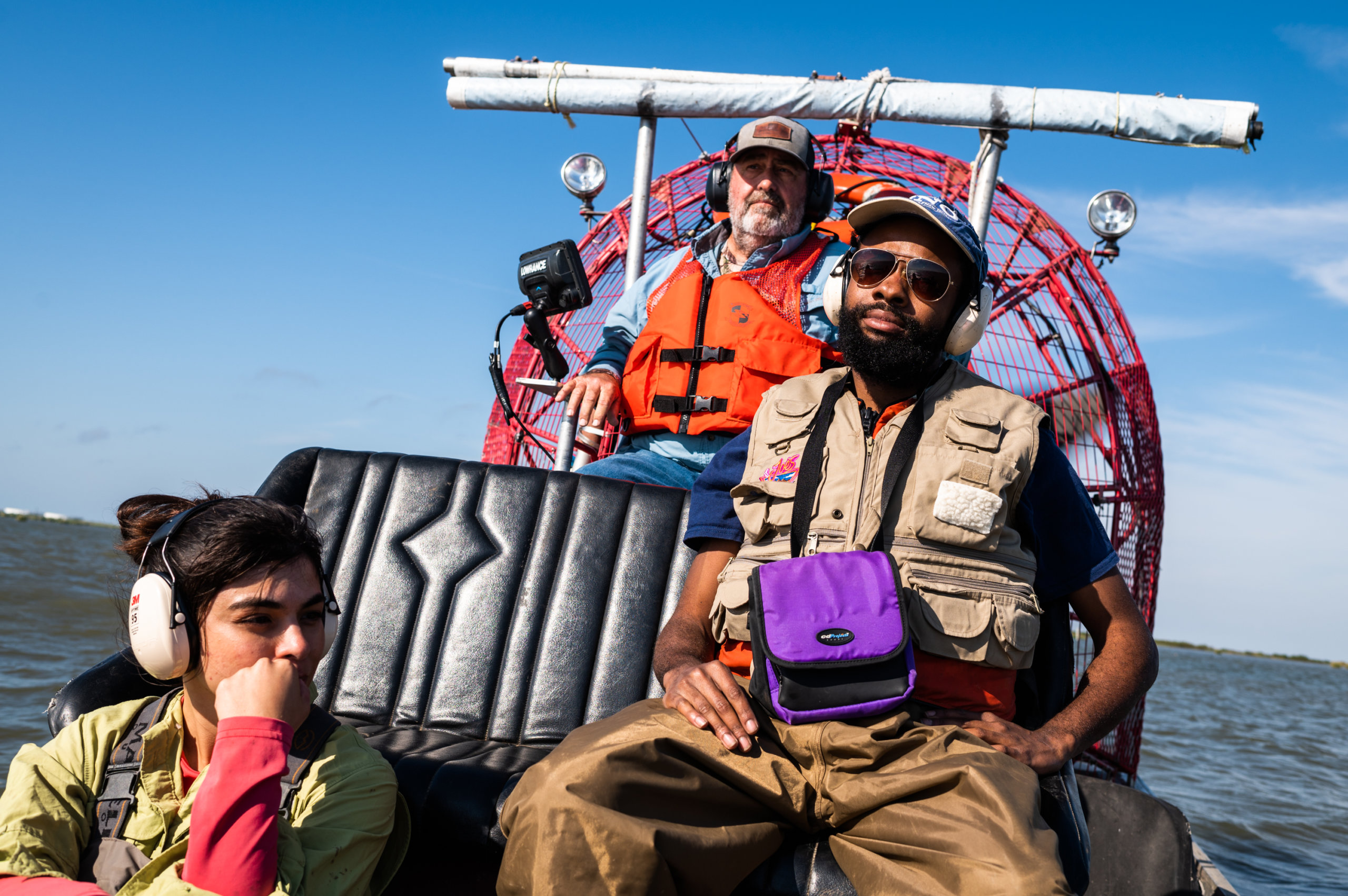 Crew from Water Institute of the Gulf on an airboat en route to a research platform site