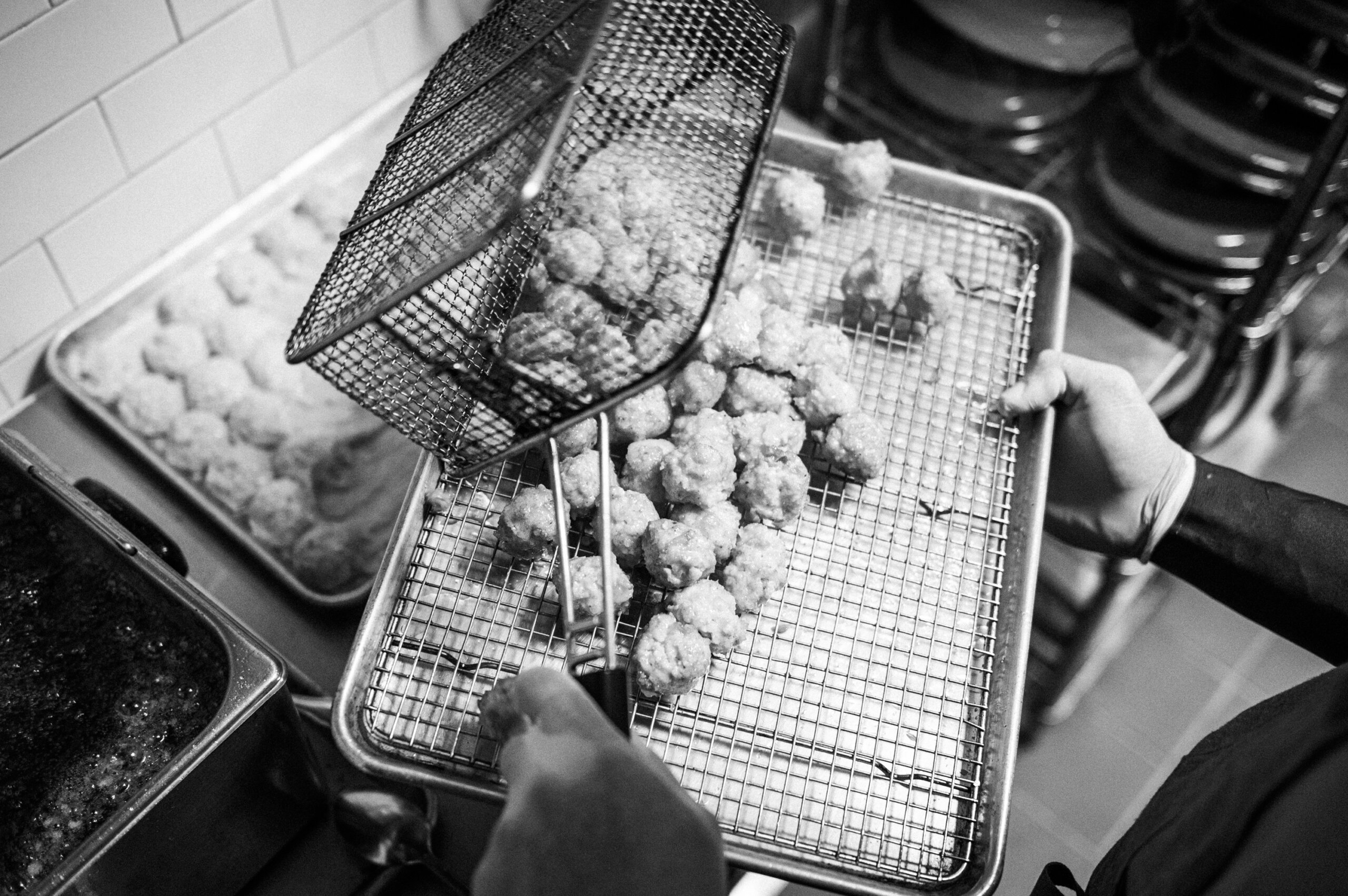 Fritters removed from the fryer before plating