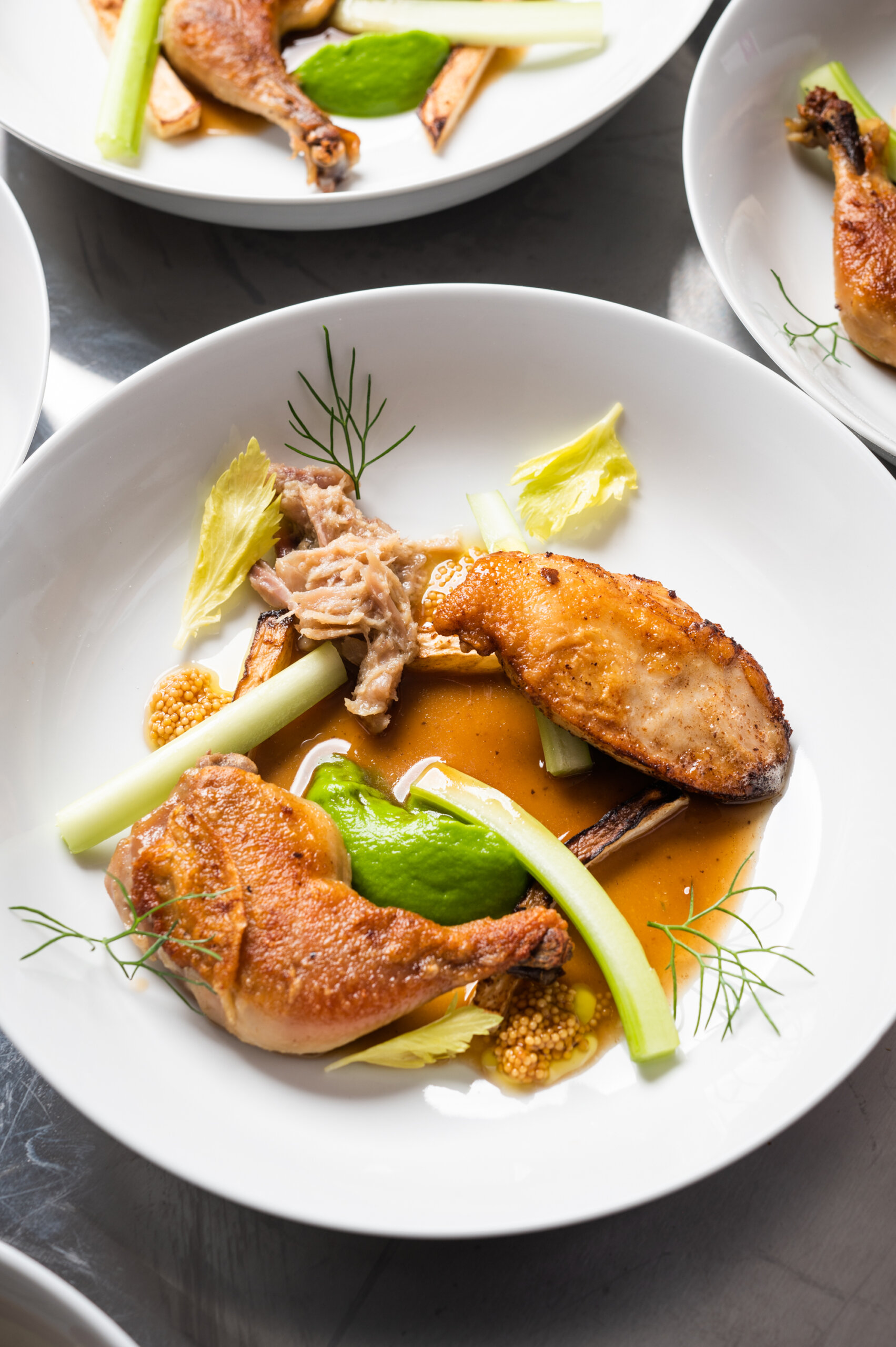 Poussin with celery, pickled mustard seeds, and jus