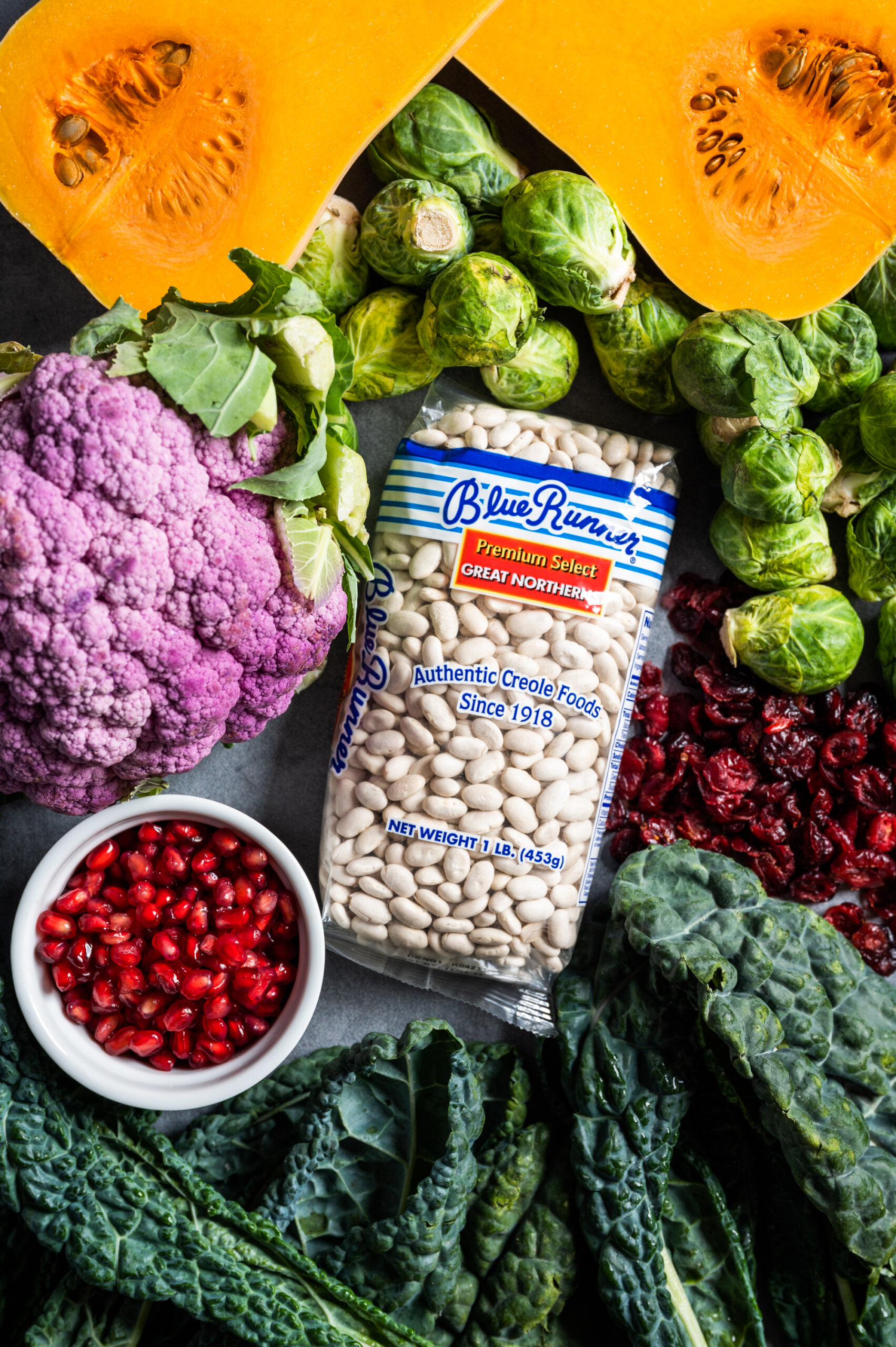 Blue Runner Foods Great Northern Beans with fresh butternut squash, kale, cauliflower, brussels sprouts, and pomegranate