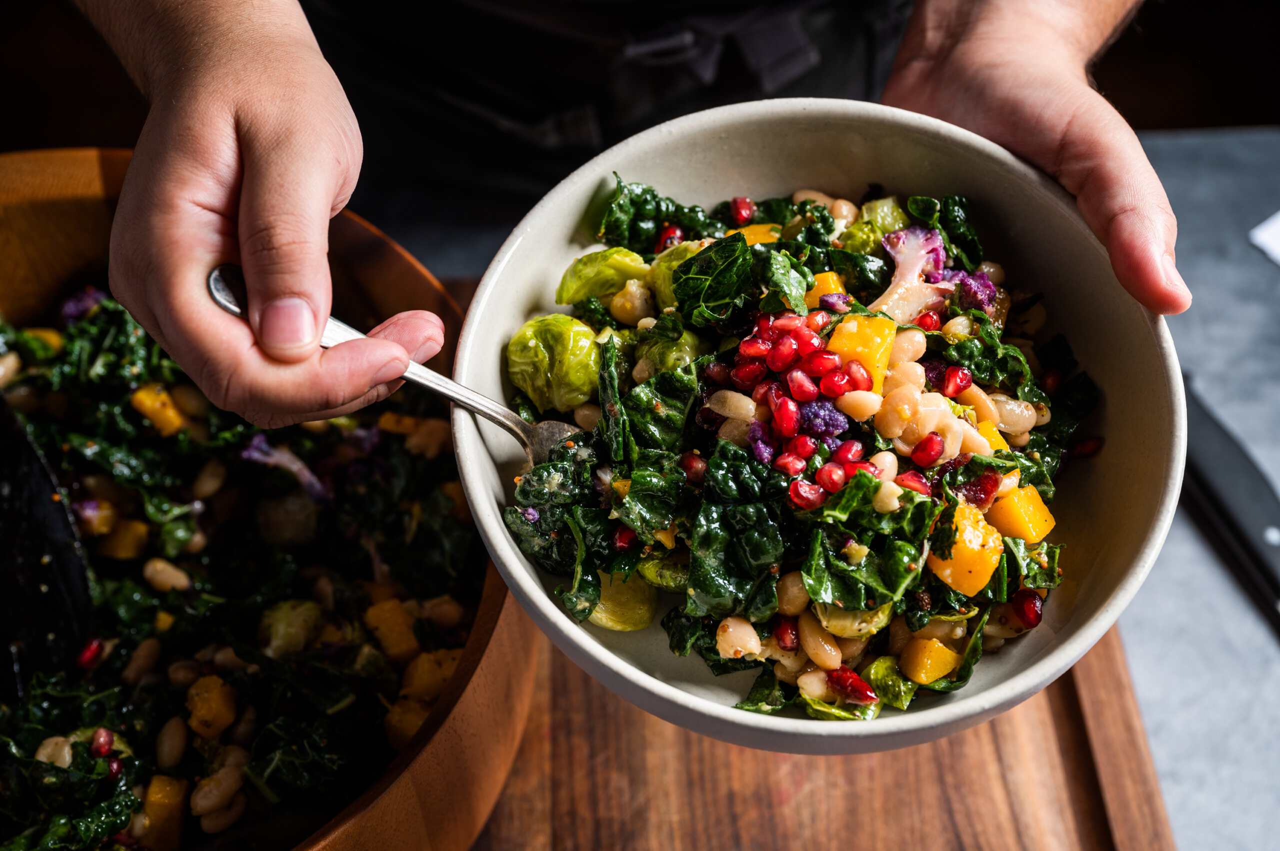 Harvest salad bowl with white beans, roasted vegetables, and pomegranate arils