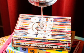 A martini atop a stack of books in the Funny Library