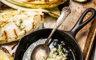 Melted bleu cheese compound butter and grilled napa cabbage