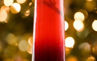 A holiday cocktail featuring California pomegranate juice and arils