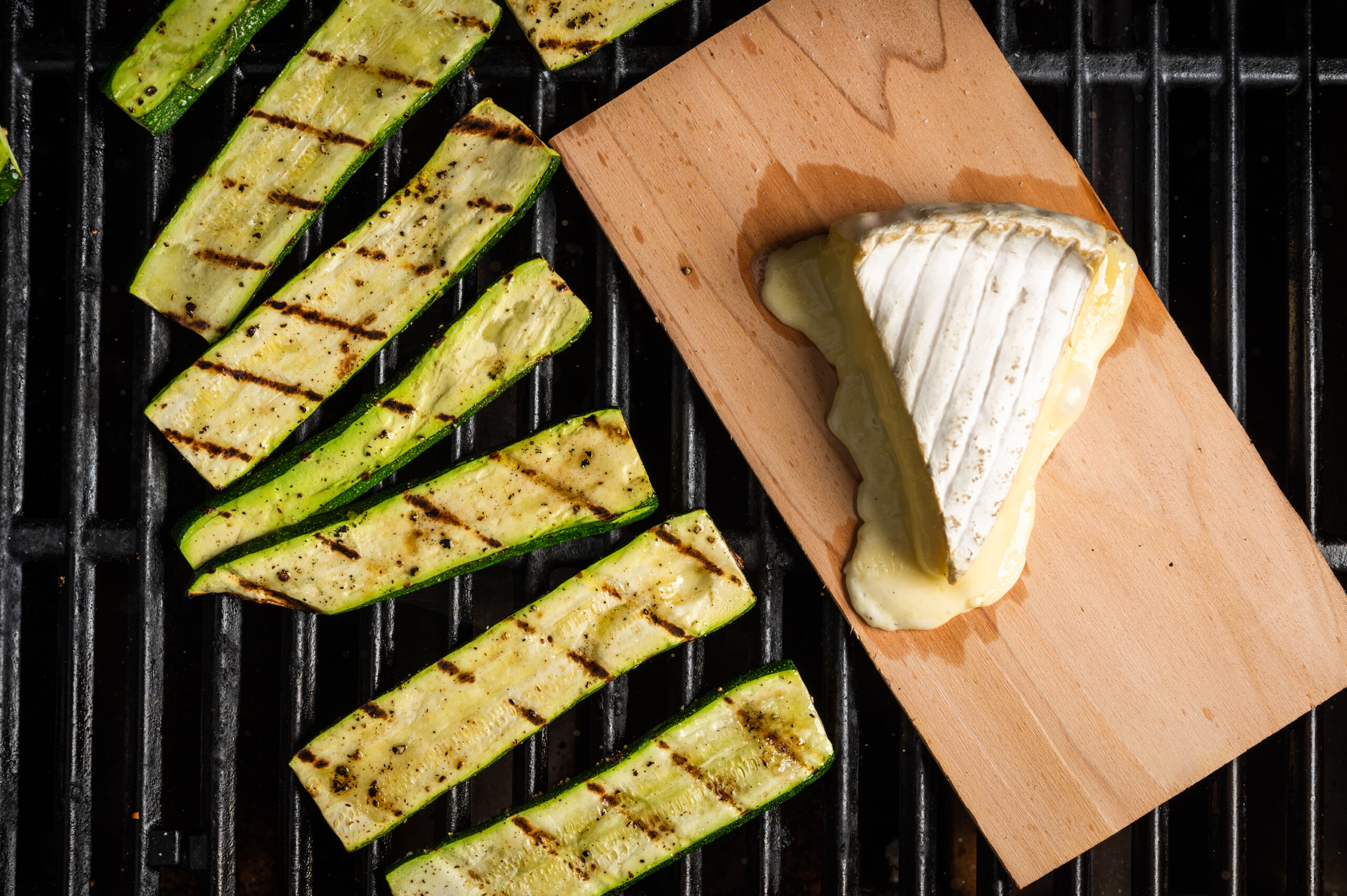 Zucchini on the grill with cedar-plank brie.