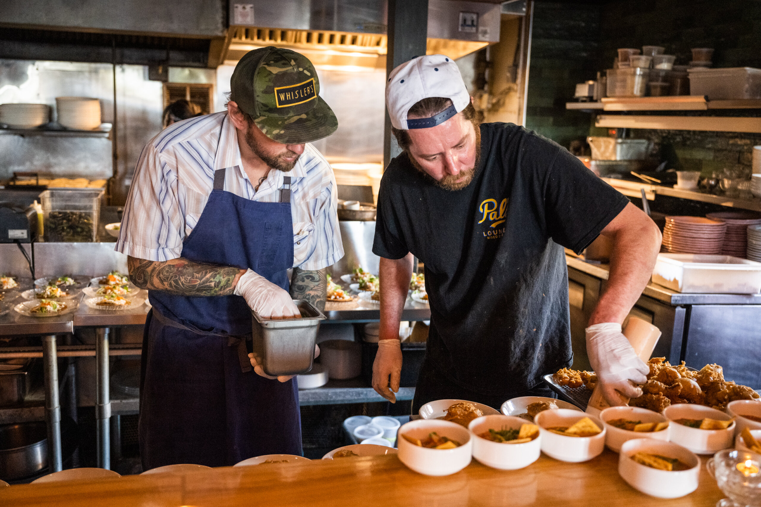 William Greenwell of Mister Mao preps food with Chef Reavely Bell
