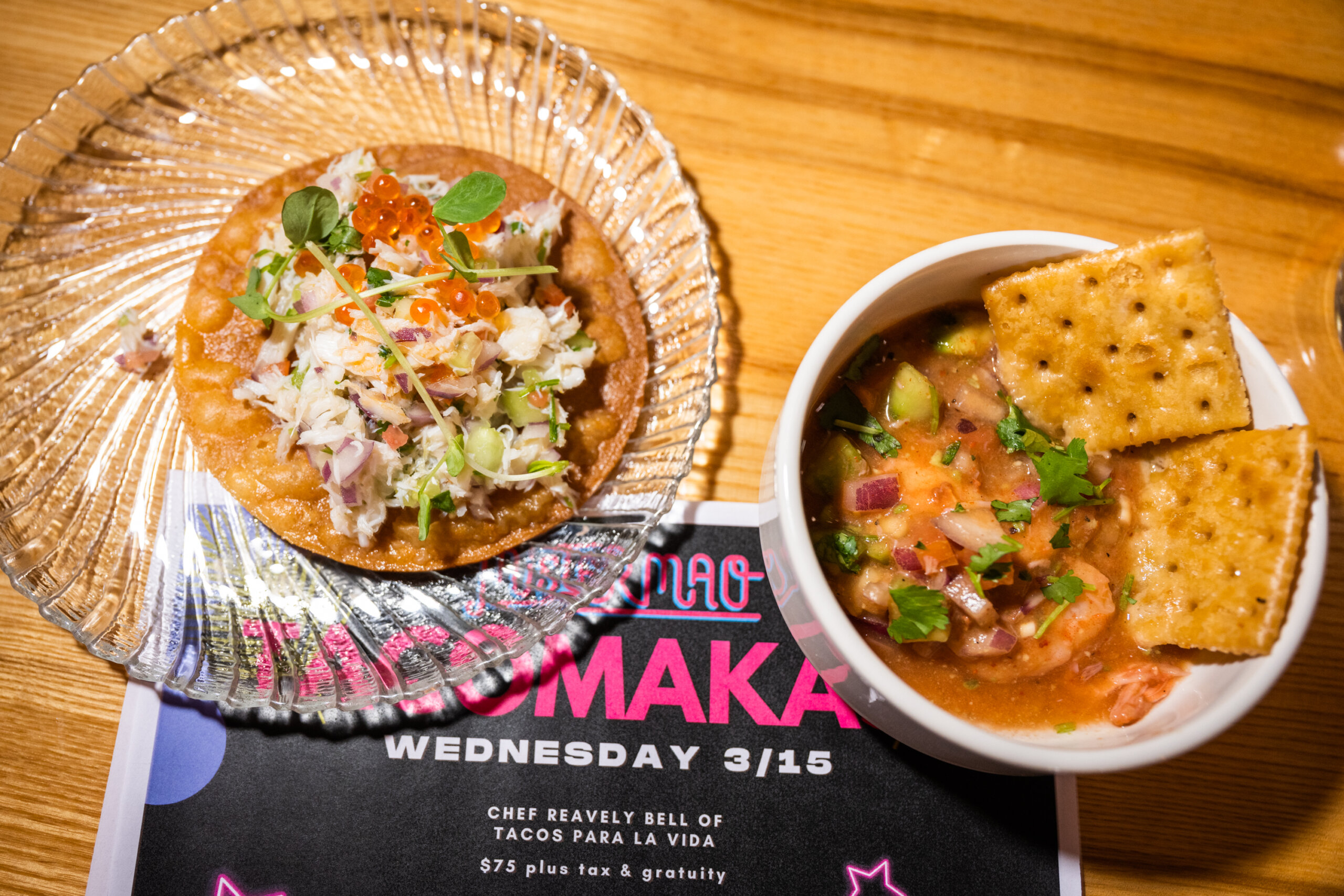A paper menu with two dishes from the first course at Tacos Para La Vida's pop-up at Mister Mao