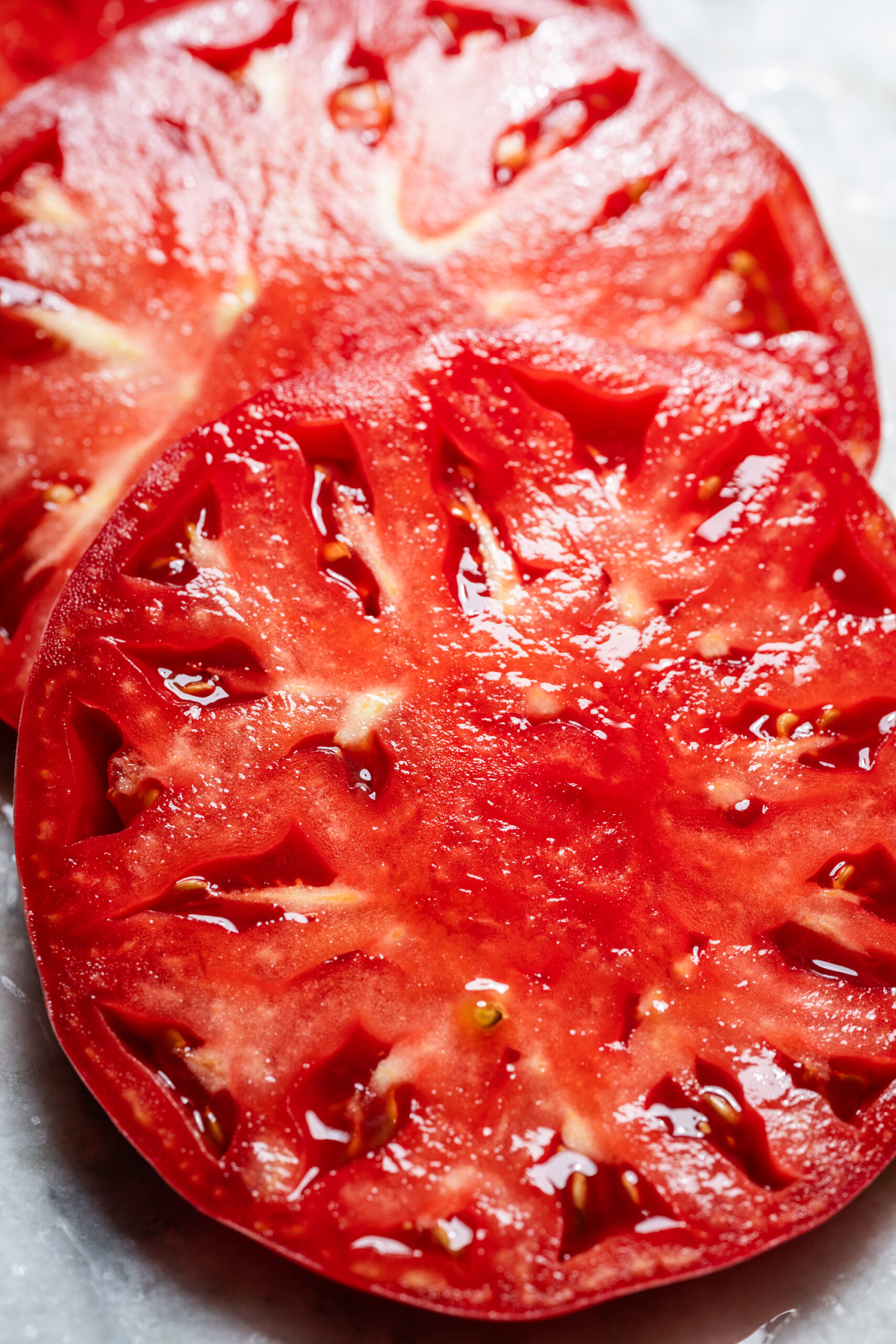 Close-up photograph of heirloom tomato slices