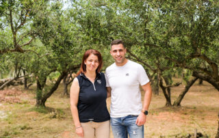 Veerna with her son, in front of her brother's olive trees