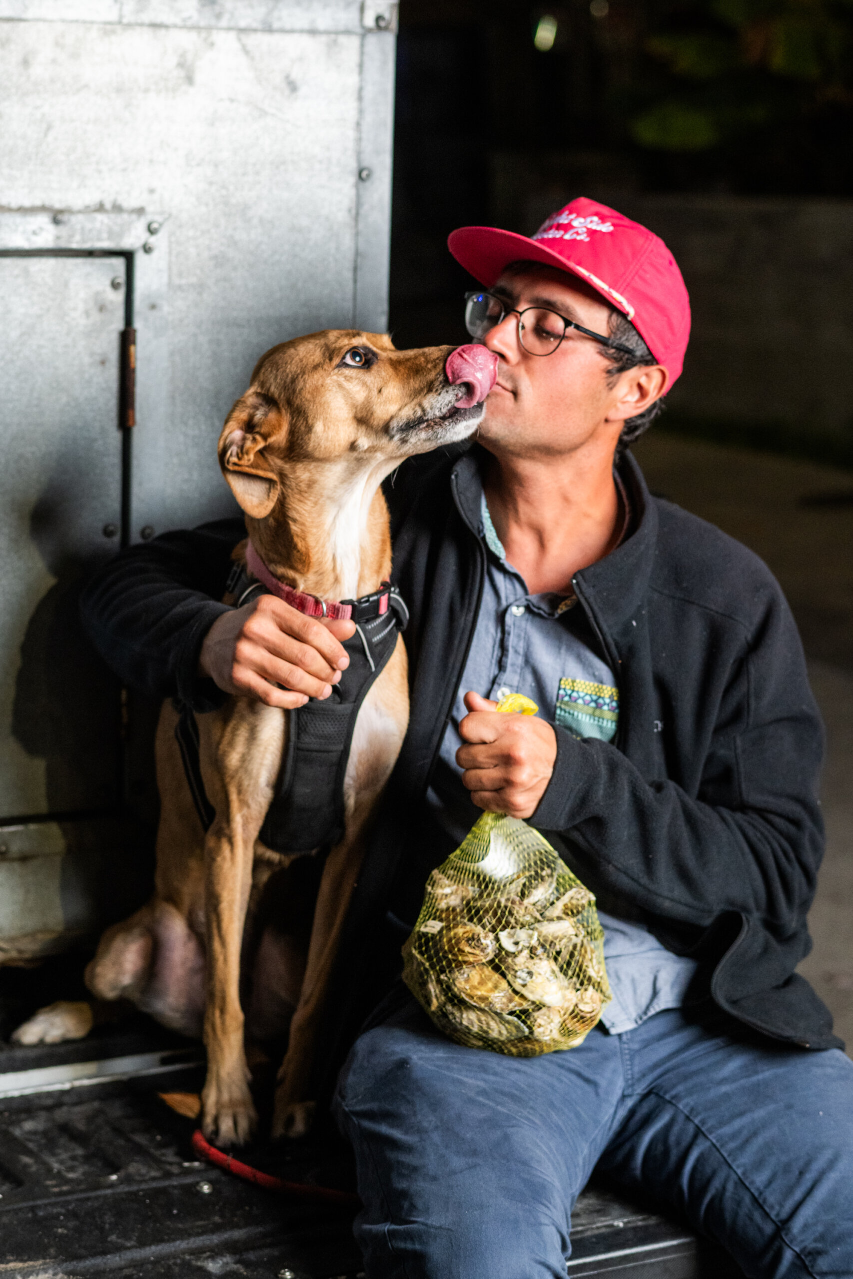Portrait of Nathan Herring of Brightside Oysters with his dog Wilma