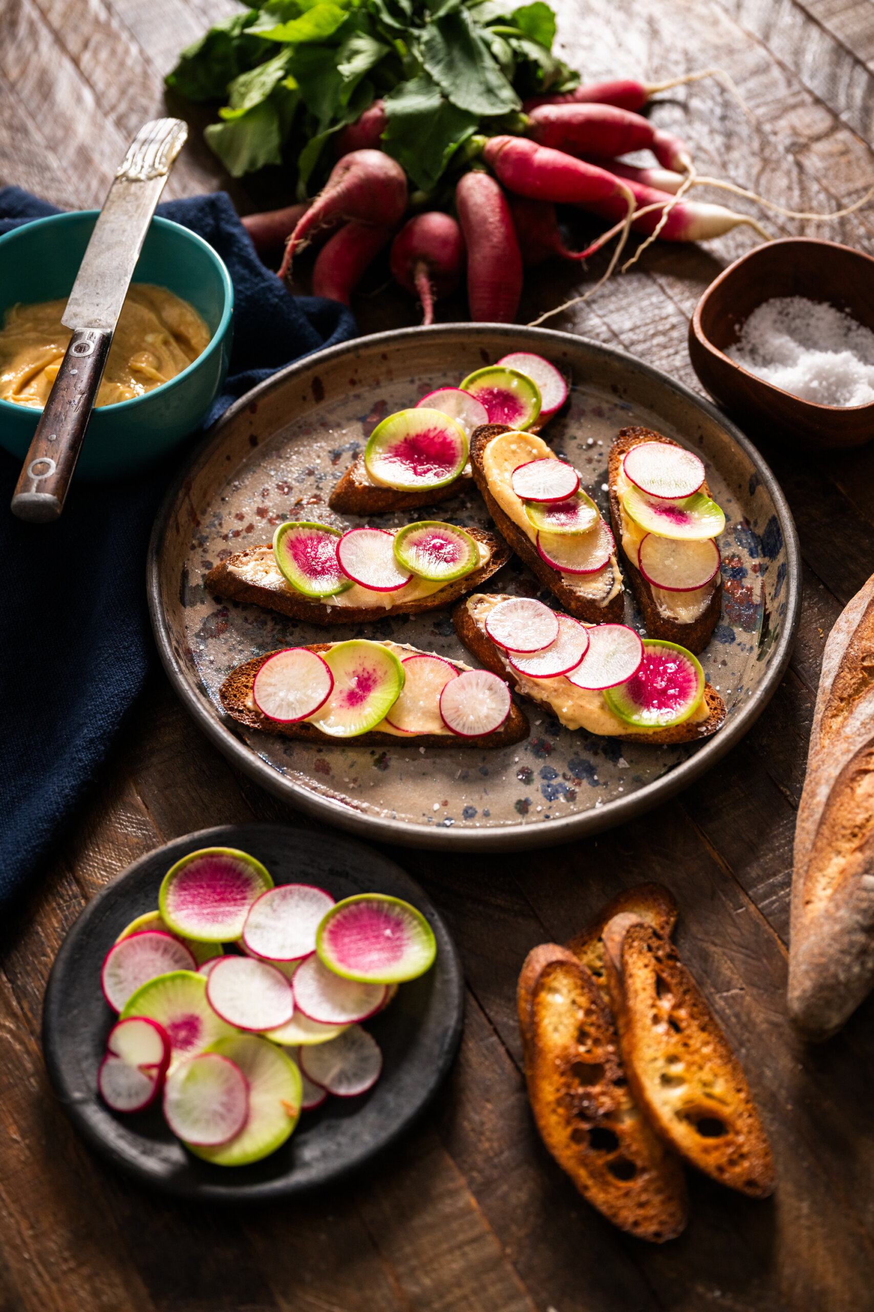 Breakfast and watermelon radishes on crostini with Lawry's compound butter