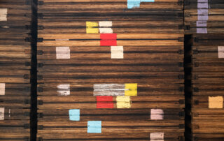 Paint markings on a stack of wooden fruit drying trays