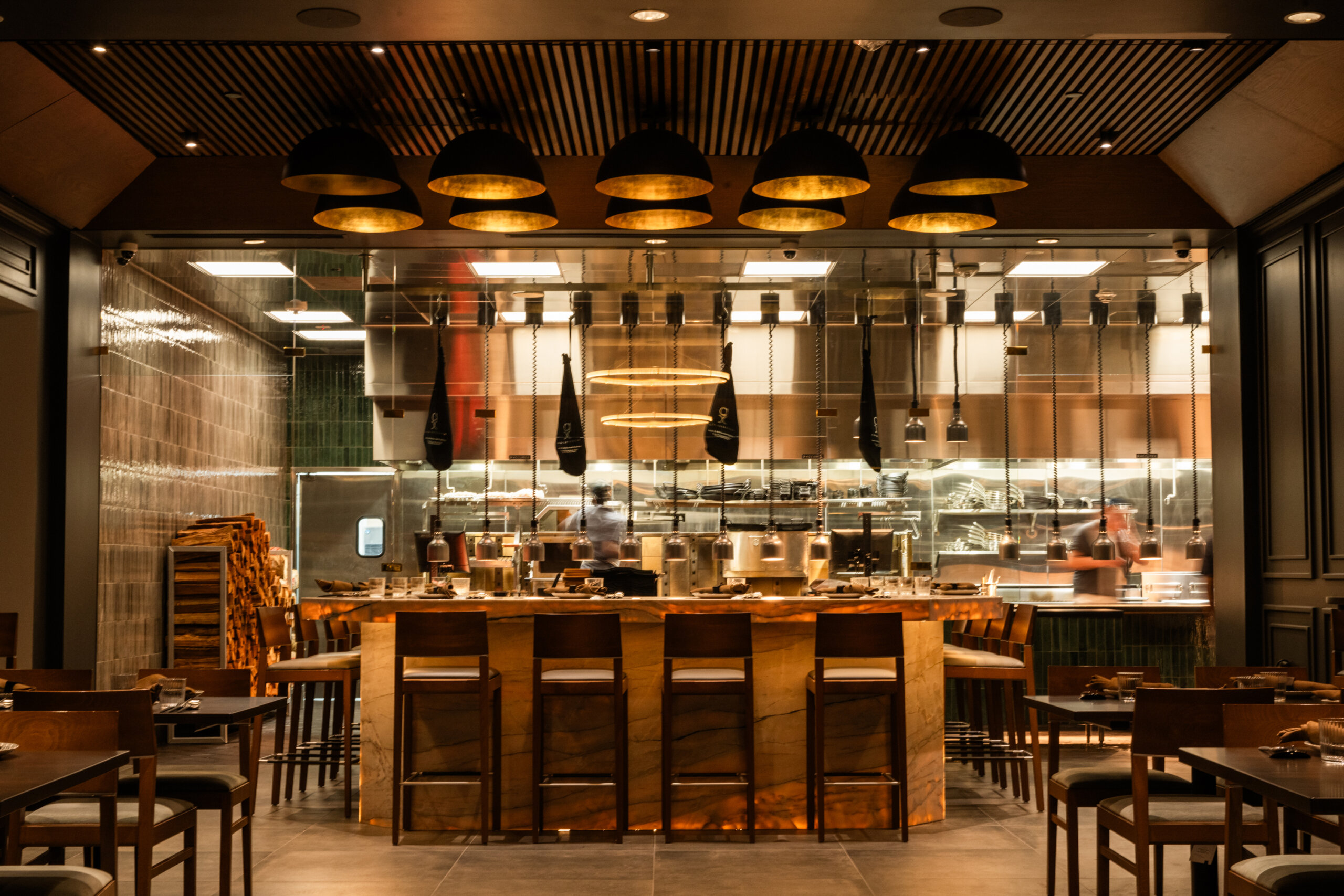 Wide shot showing the counter and kitchen