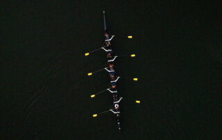 Overhead aerial image showing Xavier's 8-person rowing crew