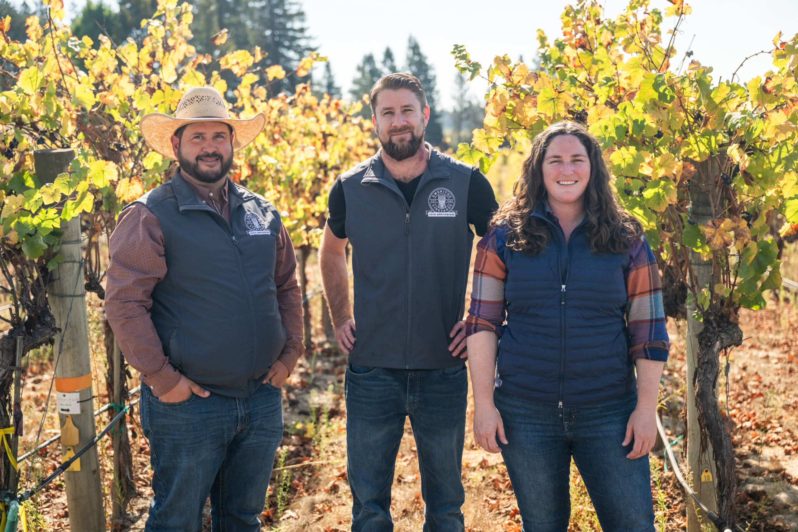 Group portrait of Riggs Lokka, Keith Hammond, and Mari Jones of Emeritus Vineyards